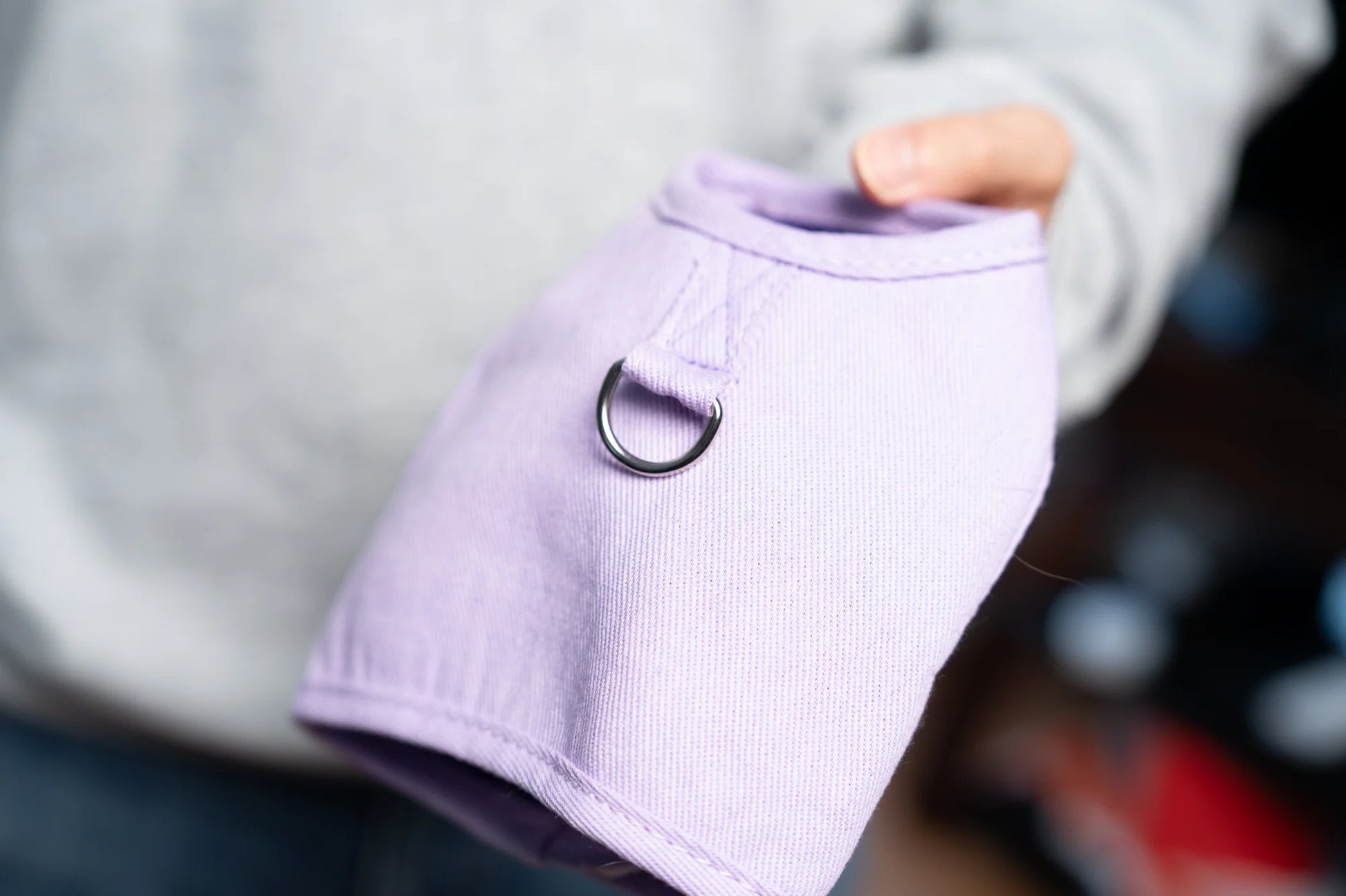 Close-up of Purrta breathable cat harness in lavender showing D-ring leash attachment and soft fabric